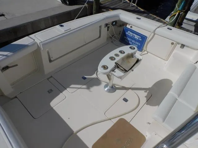 Mad Hatter Yacht Photos Pics 1997 Tiara Yachts Open boat deck with fishing rod holders and seating.