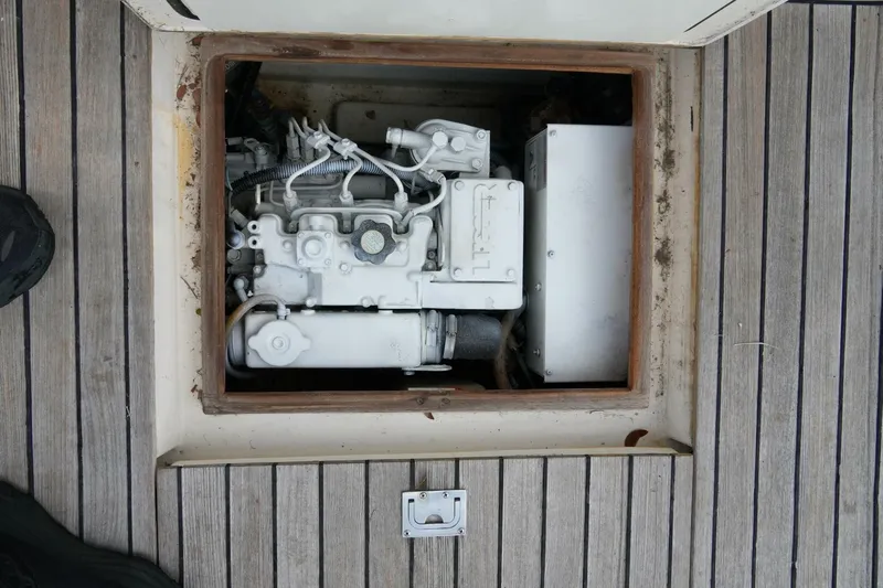 R & R Yacht Photos Pics Engine compartment of 2000 Stolper 3800 Tournament Express, featuring a compact marine engine.