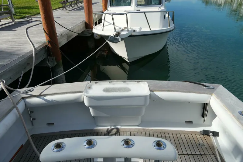 R & R Yacht Photos Pics 2000 Stolper 3800 Tournament Express boat docked at marina, view from stern.