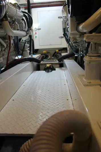 R & R Yacht Photos Pics Engine room of 2000 Stolper 3800 Tournament Express with visible machinery and piping.