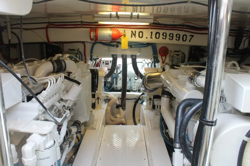 R & R Yacht Photos Pics Engine room of 2000 Stolper 3800 Tournament Express with visible machinery and equipment.