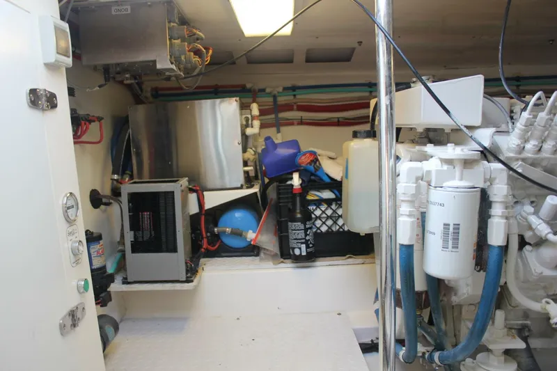 R & R Yacht Photos Pics Engine room of 2000 Stolper 3800 Tournament Express with equipment and storage.