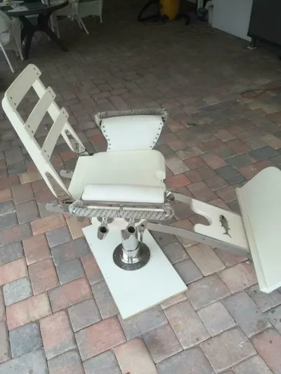 R & R Yacht Photos Pics Fishing chair on Stolper 3800 Tournament Express, 2000 model, on brick patio.