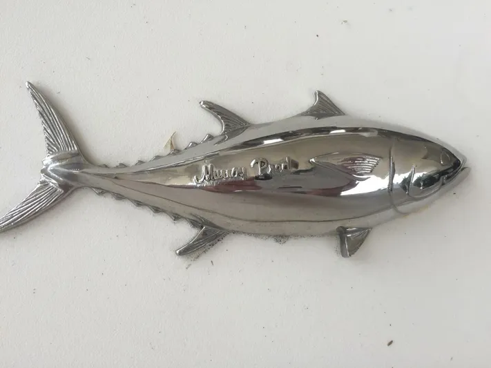 R & R Yacht Photos Pics Chrome fish emblem on Stolper 3800 Tournament Express, 2000 model.