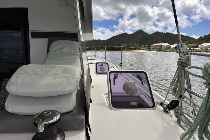  Yacht Photos Pics 2016 Lagoon 42 catamaran deck with cushions, ropes, and scenic mountain view.