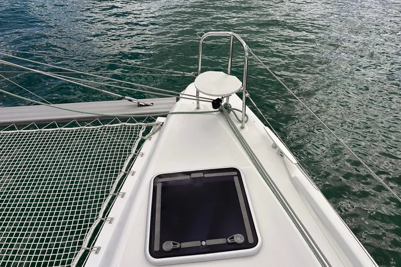  Yacht Photos Pics Bow of 2016 Lagoon 42 catamaran with netting and ocean view.