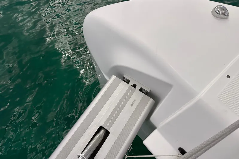  Yacht Photos Pics Lagoon 42 catamaran (2016) with a retractable gangway over turquoise water.