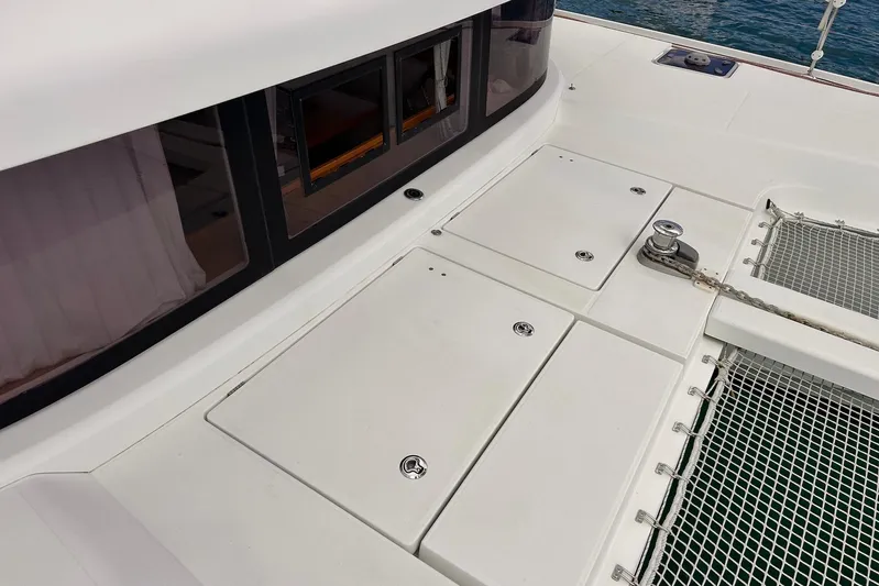  Yacht Photos Pics Deck of 2016 Lagoon 42 catamaran with storage hatches and netting.