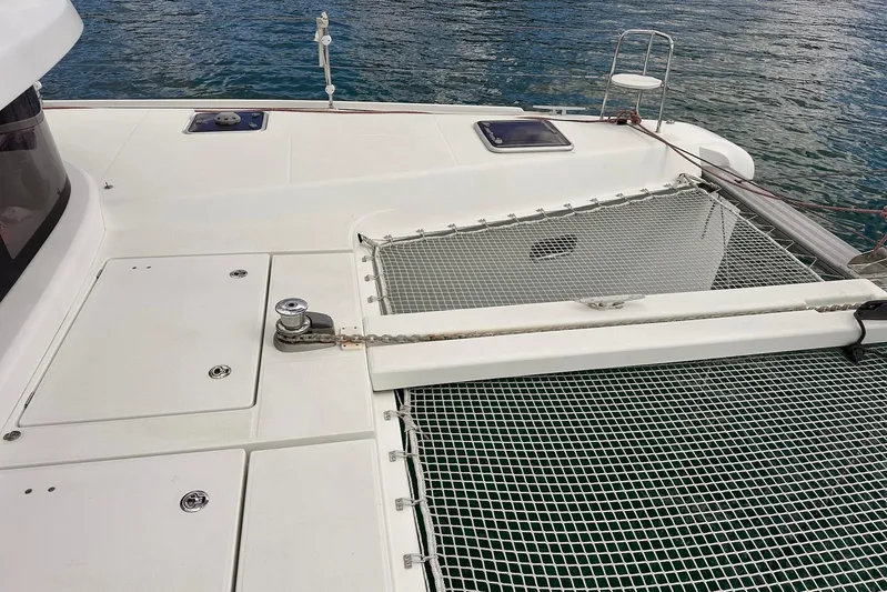  Yacht Photos Pics 2016 Lagoon 42 catamaran deck with netting over water.