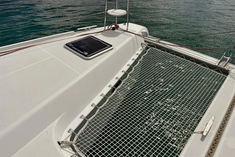  Yacht Photos Pics 2016 Lagoon 42 catamaran deck with netting over water.