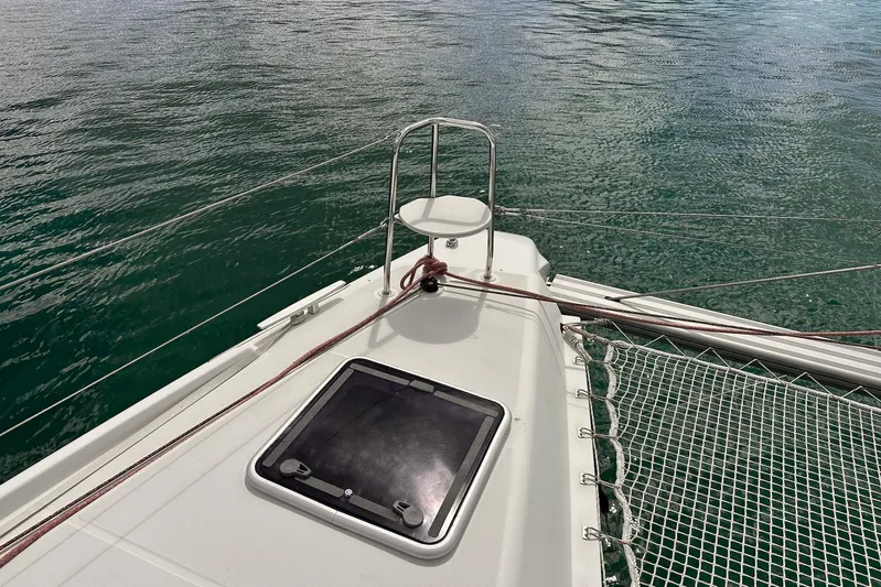  Yacht Photos Pics Deck of 2016 Lagoon 42 catamaran with netting and ocean view.