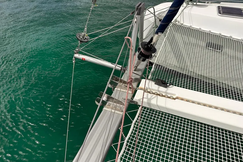  Yacht Photos Pics Catamaran deck of 2016 Lagoon 42 with netting over turquoise water.