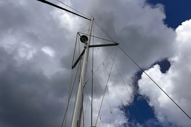  Yacht Photos Pics Mast of 2016 Lagoon 42 sailboat against cloudy sky.