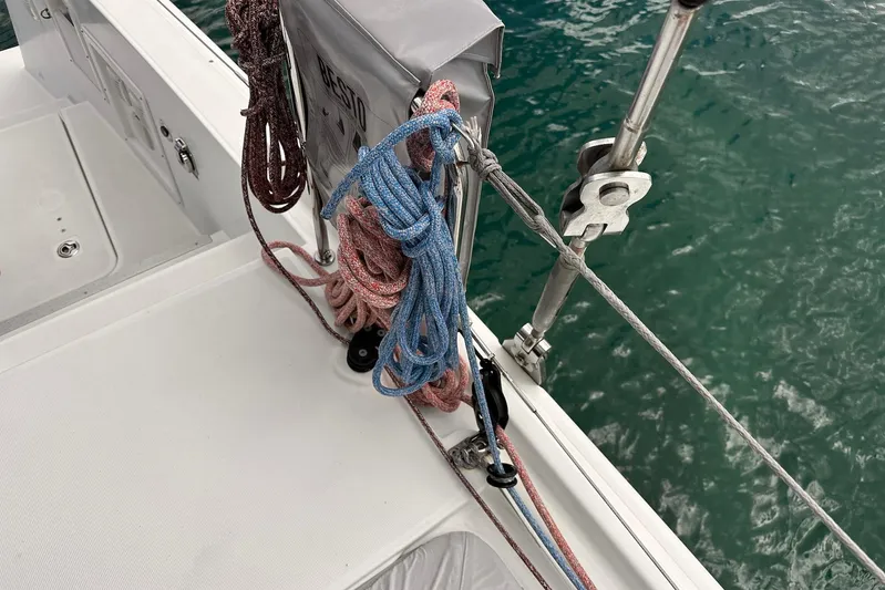  Yacht Photos Pics Deck view of 2016 Lagoon 42 sailboat with ropes and ocean background.