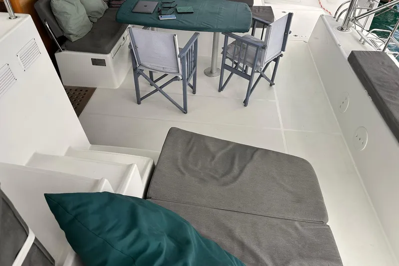  Yacht Photos Pics Interior of 2016 Lagoon 42 catamaran with seating and table setup.