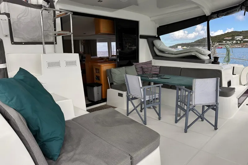  Yacht Photos Pics Interior of 2016 Lagoon 42 catamaran with seating area and ocean view.