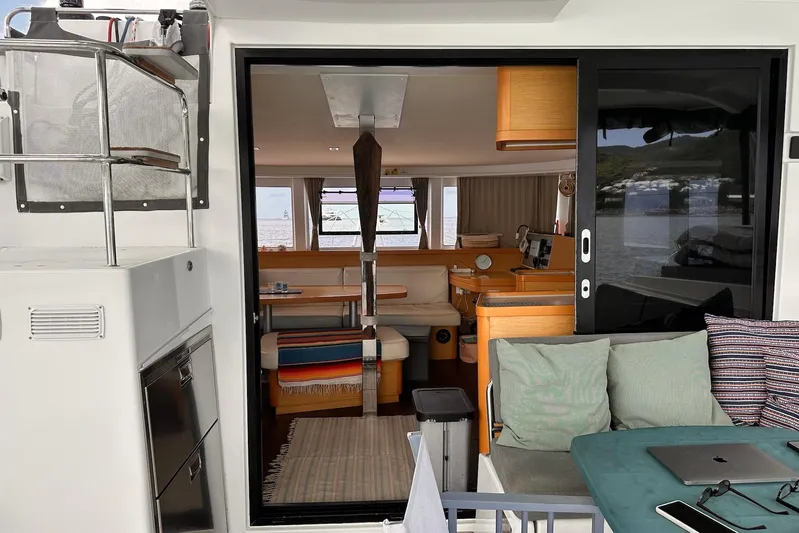  Yacht Photos Pics Interior view of a 2016 Lagoon 42 catamaran, featuring cozy seating and modern amenities.