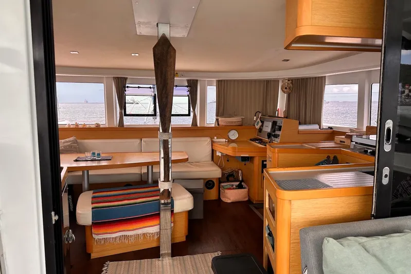 Yacht Photos Pics Interior of 2016 Lagoon 42 catamaran with cozy seating and ocean view.