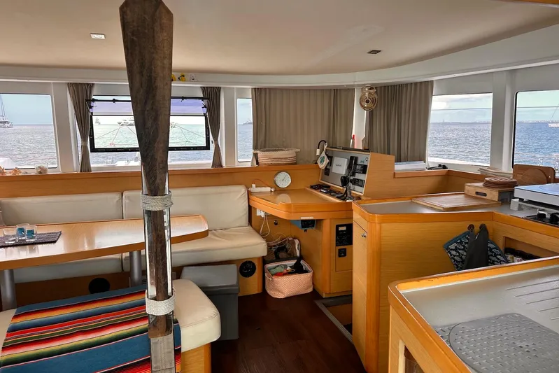  Yacht Photos Pics Interior of 2016 Lagoon 42 catamaran with panoramic windows and modern furnishings.