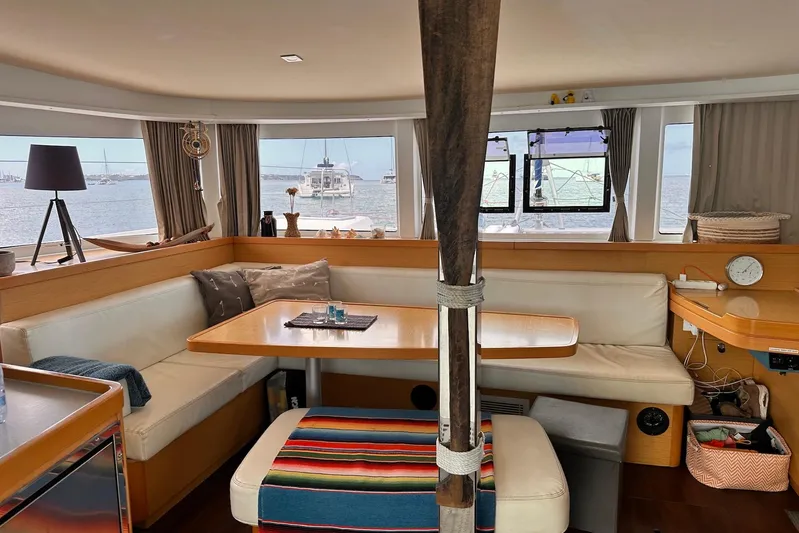  Yacht Photos Pics Interior of a 2016 Lagoon 42 catamaran with cozy seating and ocean view.