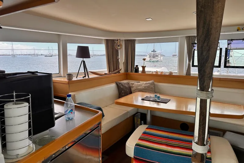 Yacht Photos Pics Interior of 2016 Lagoon 42 catamaran with cozy seating and ocean view.