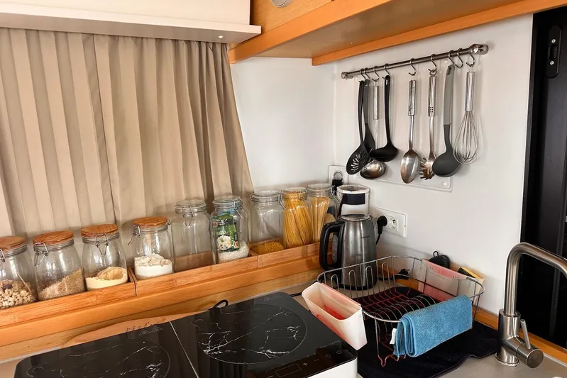  Yacht Photos Pics Modern kitchen in 2016 Lagoon 42 catamaran with utensils and glass jars.