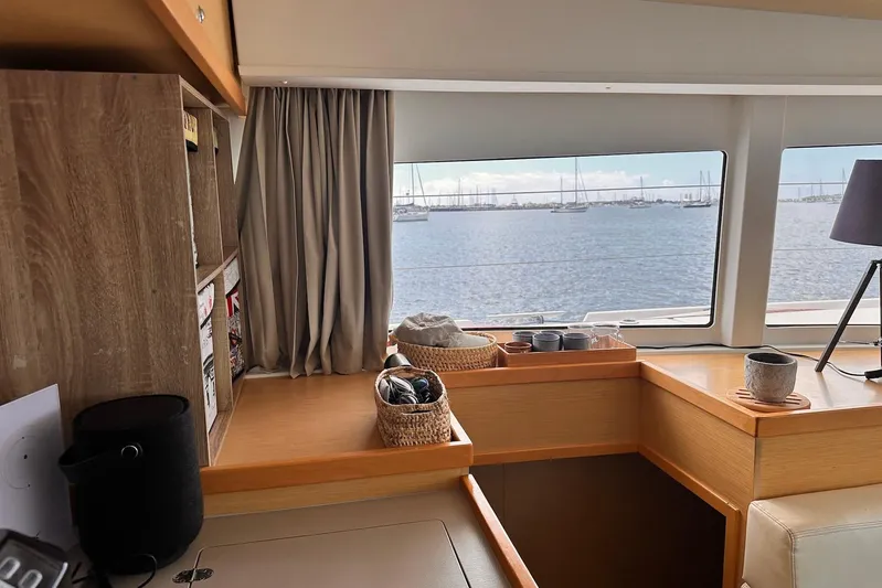  Yacht Photos Pics Interior of 2016 Lagoon 42 yacht with ocean view through large windows.