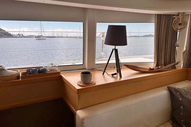  Yacht Photos Pics Interior of 2016 Lagoon 42 yacht with sea view through large windows.