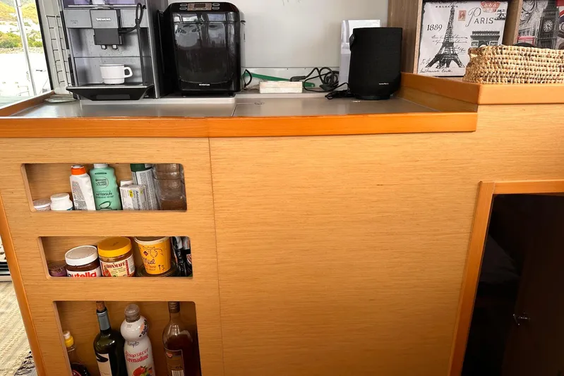  Yacht Photos Pics Kitchen area on a 2016 Lagoon 42 yacht with coffee machines and storage shelves.