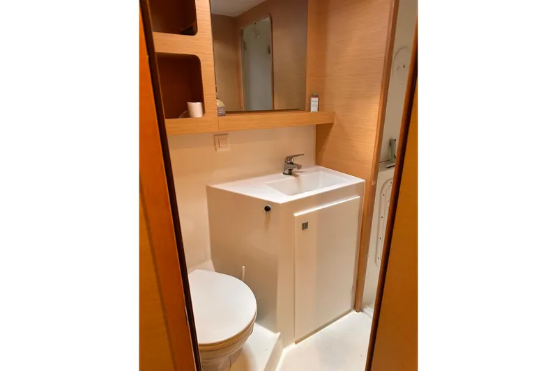  Yacht Photos Pics Bathroom interior of 2016 Lagoon 42 catamaran with modern sink and toilet.