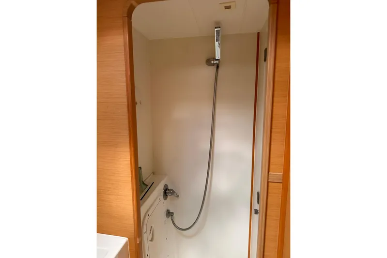  Yacht Photos Pics Shower area in 2016 Lagoon 42 yacht, featuring modern fixtures and wooden accents.