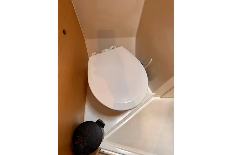  Yacht Photos Pics Toilet in 2016 Lagoon 42 yacht bathroom, featuring compact design and modern fixtures.