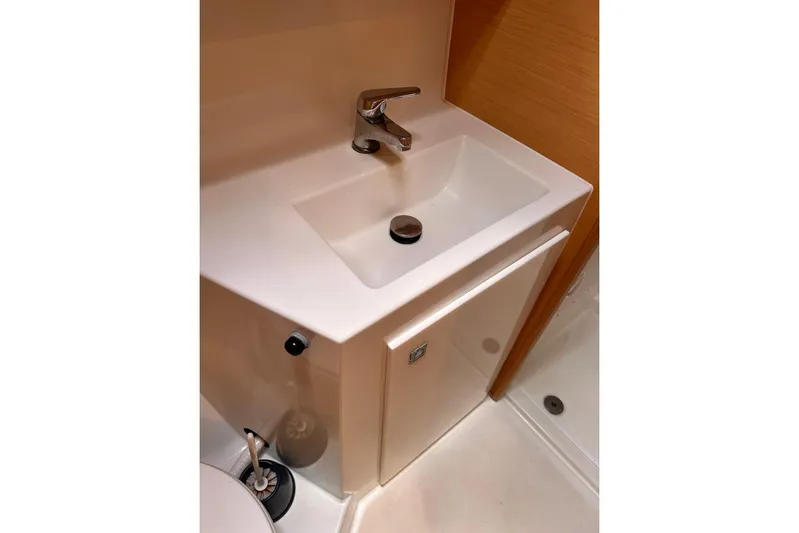  Yacht Photos Pics Bathroom sink in 2016 Lagoon 42 yacht, featuring modern faucet and compact design.