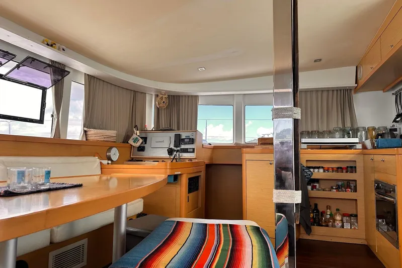  Yacht Photos Pics Interior of 2016 Lagoon 42 catamaran with modern kitchen and dining area.