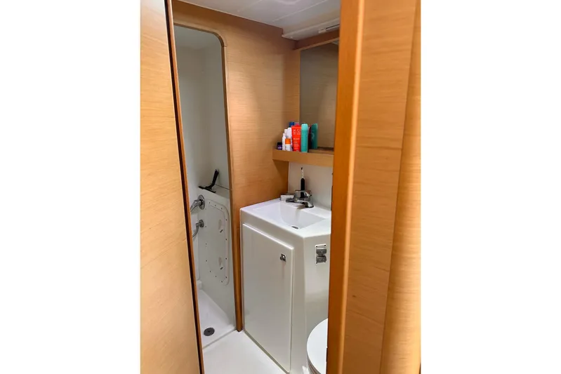  Yacht Photos Pics Bathroom interior of 2016 Lagoon 42 yacht with sink and toiletries.