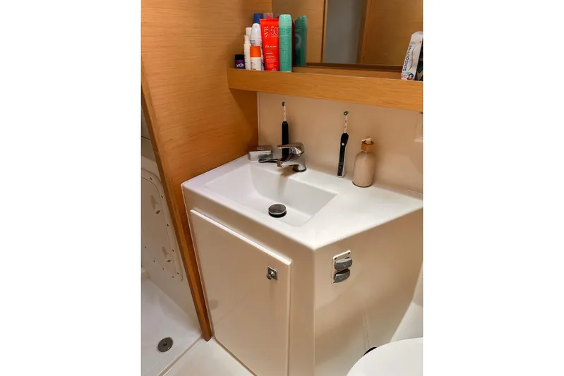  Yacht Photos Pics Bathroom sink area in 2016 Lagoon 42 yacht with toiletries and mirror.