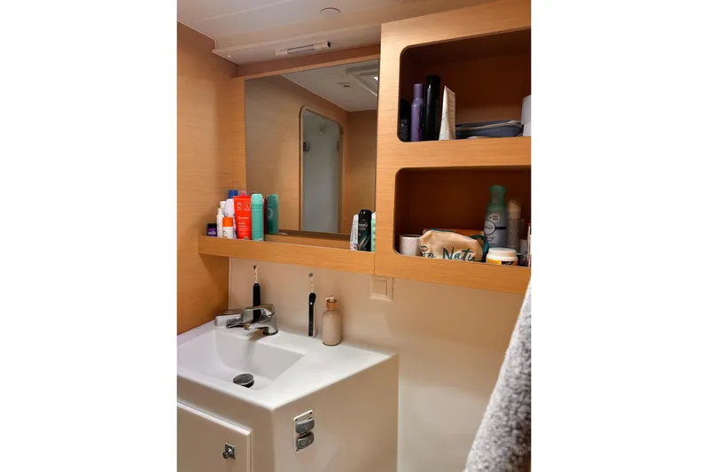  Yacht Photos Pics Bathroom interior of 2016 Lagoon 42 yacht with sink and toiletries.