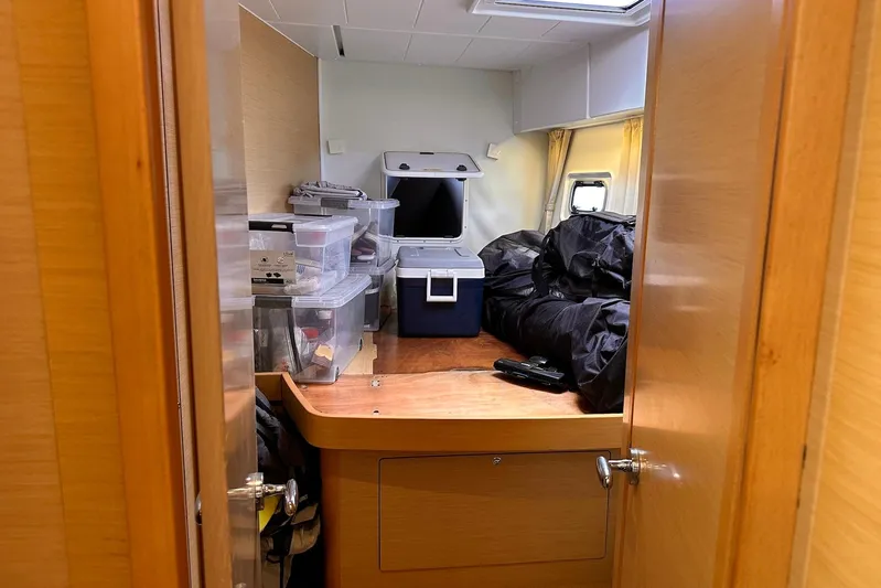  Yacht Photos Pics Interior cabin of a 2016 Lagoon 42 yacht with storage boxes and equipment.