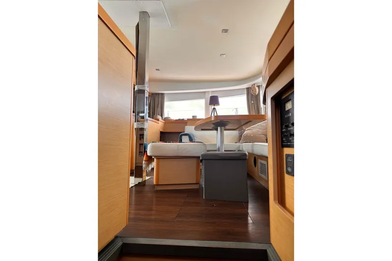  Yacht Photos Pics Interior of 2016 Lagoon 42 catamaran with modern furnishings and wooden accents.