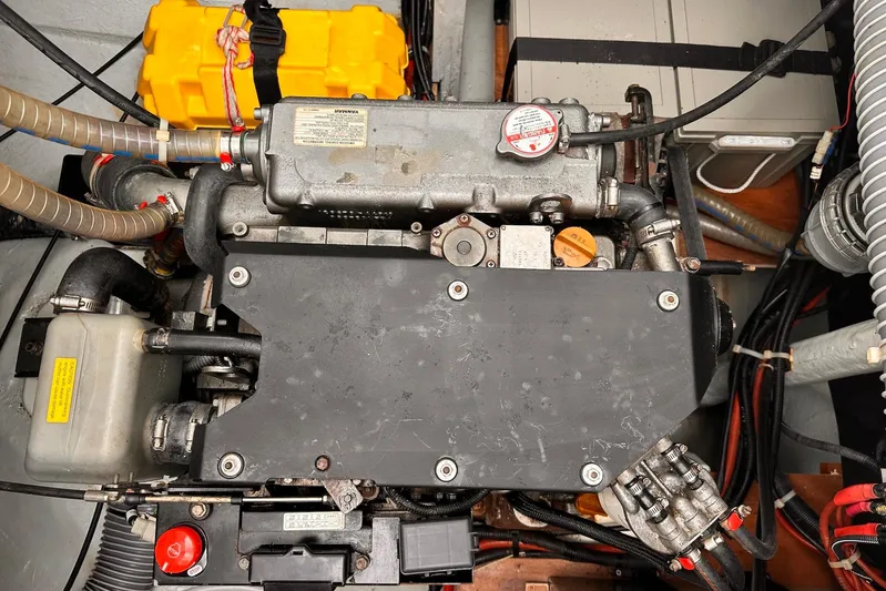  Yacht Photos Pics Engine compartment of a 2016 Lagoon 42 catamaran, showcasing mechanical components and wiring.