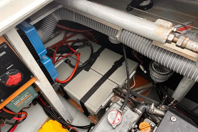  Yacht Photos Pics Engine compartment of a 2016 Lagoon 42 catamaran with visible wiring and components.