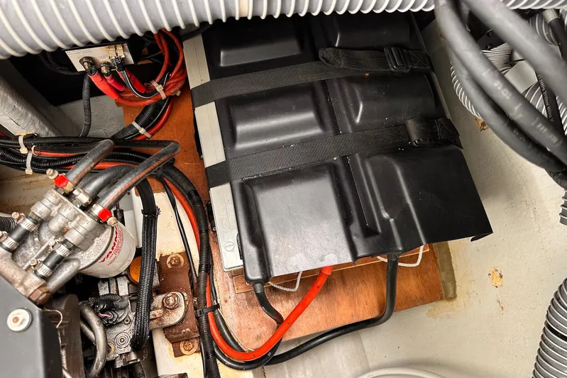  Yacht Photos Pics Engine compartment of a 2016 Lagoon 42 catamaran, showing battery and wiring setup.