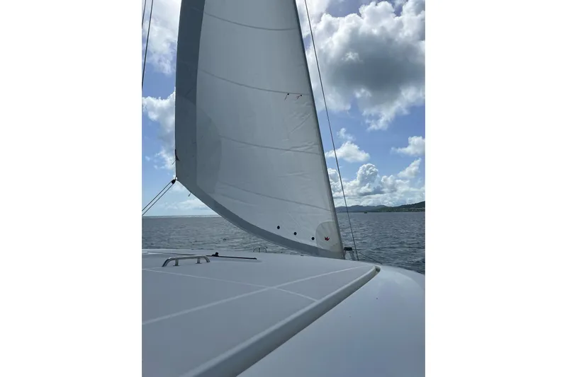  Yacht Photos Pics Sailing on a 2016 Lagoon 42 catamaran under clear skies and calm sea.