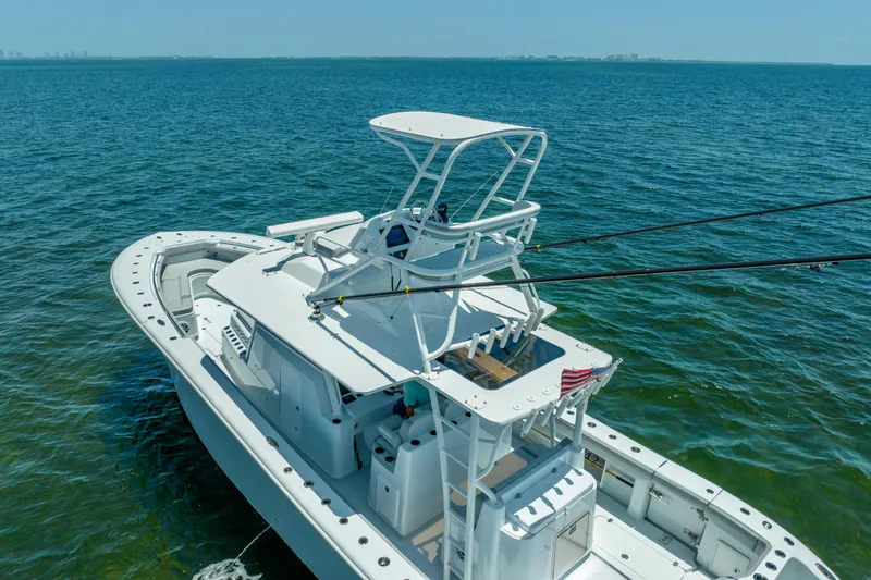  Yacht Photos Pics 2023 Yellowfin 42 Offshore boat on open water, featuring a sleek design and spacious deck.