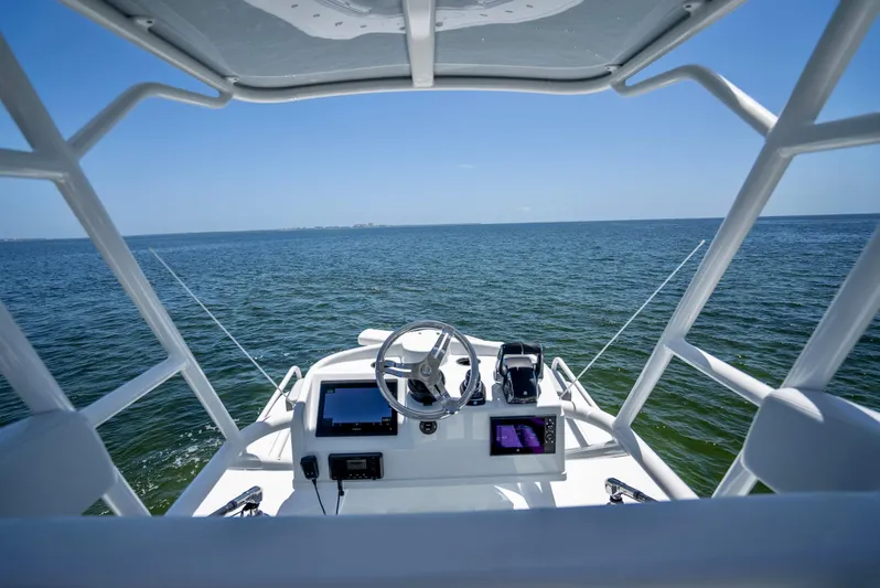  Yacht Photos Pics 2023 Yellowfin 42 Offshore boat dashboard with ocean view.