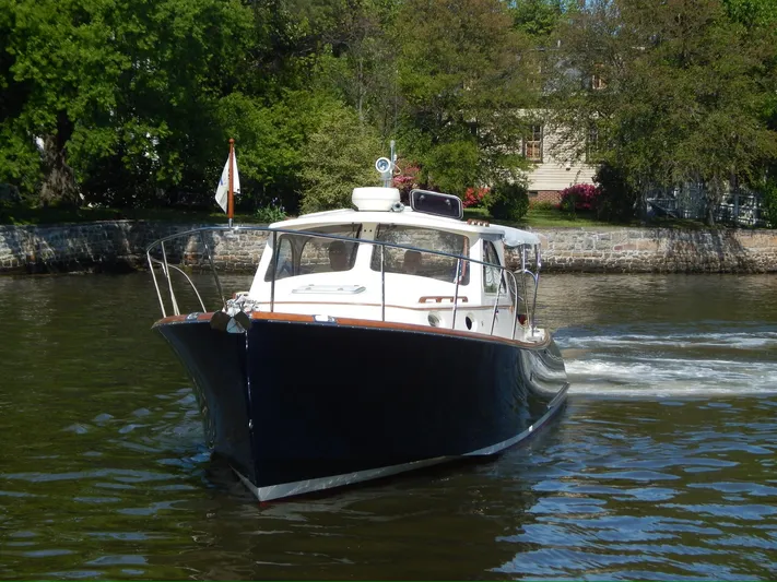  Yacht Photos Pics 2001 Hinckley Classic 36 Picnic Boat cruising on a scenic river.