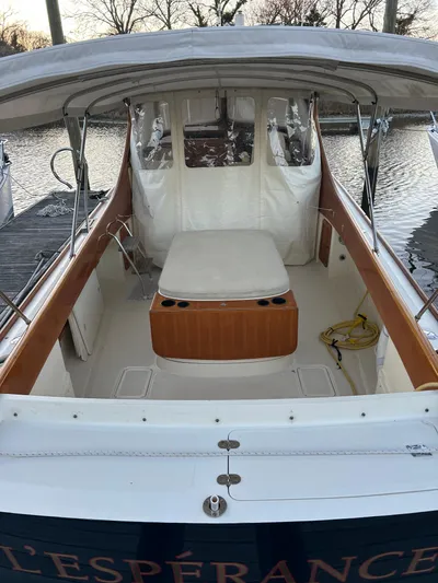  Yacht Photos Pics 2001 Hinckley Classic 36 Picnic Boat with covered seating area and wooden accents.