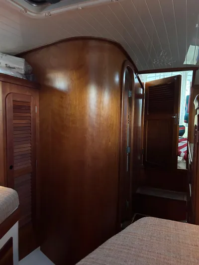  Yacht Photos Pics Interior of 2001 Hinckley Classic 36 Picnic Boat with wooden cabinetry and cozy seating.