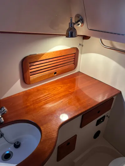  Yacht Photos Pics 2001 Hinckley Classic 36 Picnic Boat interior with wooden countertop and sink.