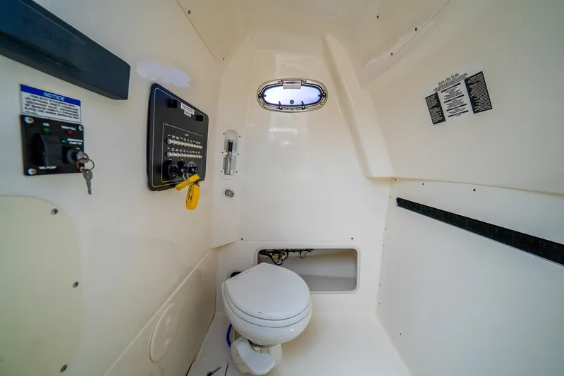 My Sherry III Yacht Photos Pics Interior of 2018 Boston Whaler 280 Outrage boat, featuring a compact marine toilet.